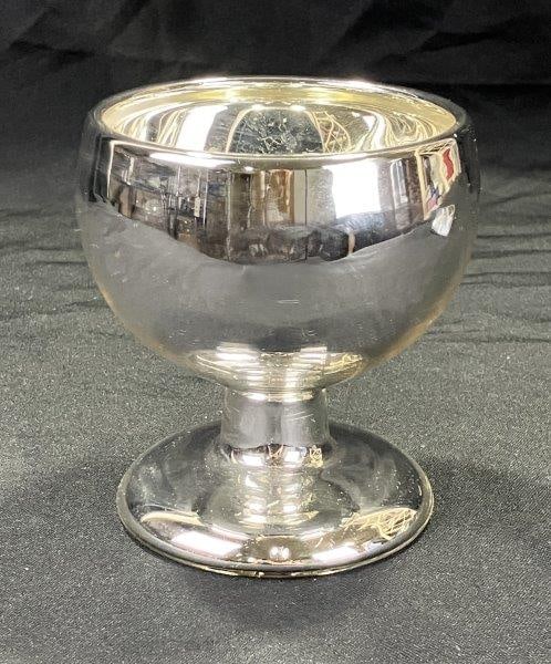 Mercury Glass Goblet: This classic mercury glass goblet features a gently rounded bowl, slender stem, and domed foot, all finished in a bright mirrored silver surface typical of 19th-century pressed and blown mercury glass