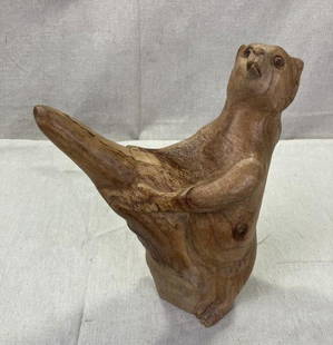 Folk Art Carving of a Bear: Charming hand-carved scene featuring a curious bear at the base of a tree. Measures approximately 9''H x 7''W x 3''D. Good condition with light wear. Shipping available. 