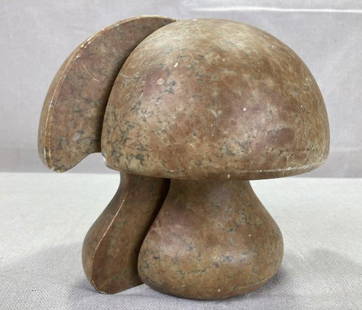 Carved Marble Mushroom Bookends: Whimsical pair of carved marble bookends in the form of mushrooms, featuring a rich dark patina and substantial weight. Made in Italy. Each measures approx. 6''H x 6''W. Some small scuffs. Shipping