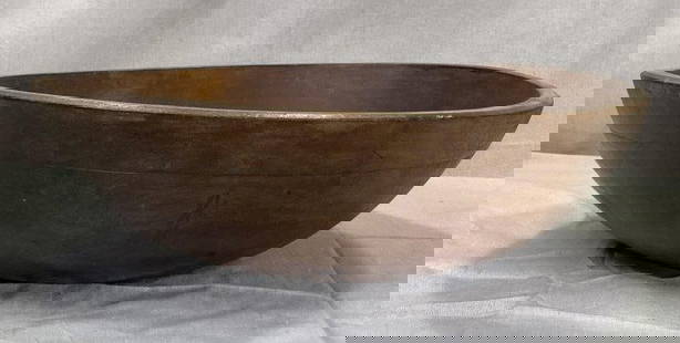 Primitive Turned Dough Bowl: Hand-turned wooden dough bowl with a beautifully rich, worn patina and classic early form. Displays subtle tool marks and excellent surface character. Measures approximately 5''H x 17'' in diameter.