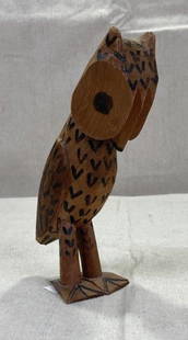 Folk Art Carved Wooden Owl: Expressive folk art carving of an owl standing at attention, rendered with charming detail and personality. A whimsical decorative piece with rustic character. Measures approx. 7''H x 2 1/4''W. Good