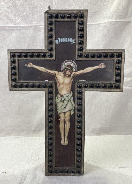 Antique Church Light: Illuminated devotional fixture featuring a metal crucifix with figure of Jesus on glass panel inscribed INRI. Warm glow when lit, likely used in a chapel or sanctuary setting. Measures approximately 1