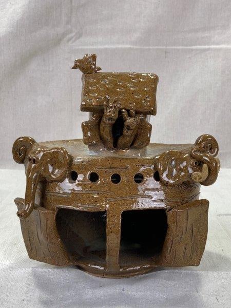 Crystal King Noahâ€™s Ark: Charming Stoneware rendition of Noahâ€™s Ark by Crystal King, featuring a rich brown glaze and finely molded details. Signed on the base. Measures approximately 8''H x 7 1/2''W x 3 1/