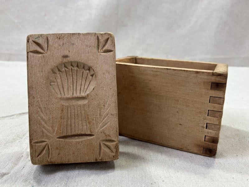 Butter Mold with Arrow Motif: Charming vintage butter mold featuring an arrow design, crafted with a natural wood finish and smooth patina. Measures approx. 4 3/8''H x 3'' in diameter. Good condition. Shipping available.