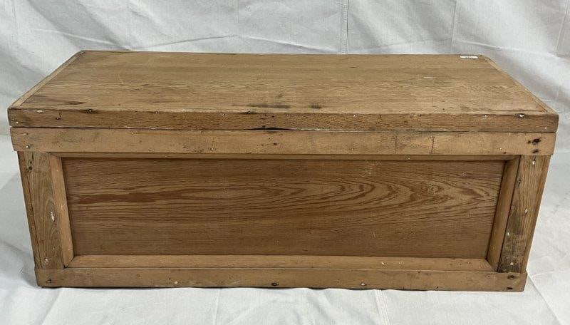 Country Yellow Pine Chest: Vintage chest featuring paneled sides and front, with a natural finish that highlights the grain and character of the pine. Measures approximately 17 1/2''H x 42''W x 19''D. Some wear to the surface c