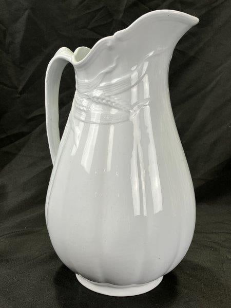 Turner Goddard Ironstone Pitcher: Elegant ironstone pitcher by Turner Goddard, featuring a beautifully molded wheat motif wrapping around the sides and handle. Marked on the base. Measures approx. 12 3/8''H x 8''W. Good condition. Shi