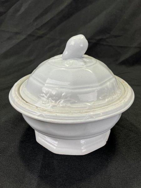 Ironstone Covered Fruit Dish: Features a floral motif around the lid with a pear-shaped finial, interior strainer, and makerâ€™s mark on the base. Measures approx. 6''T x 6 1/2'' in diameter. Some small chips and 