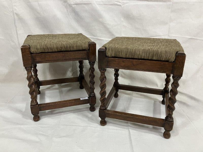 Pair of Barley Twist Stools: Charming pair of stools featuring classic barley twist legs rising to comfortably upholstered seats. Each measures approx. 16 1/2''H x 14'' square. Good condition. Shipping available.