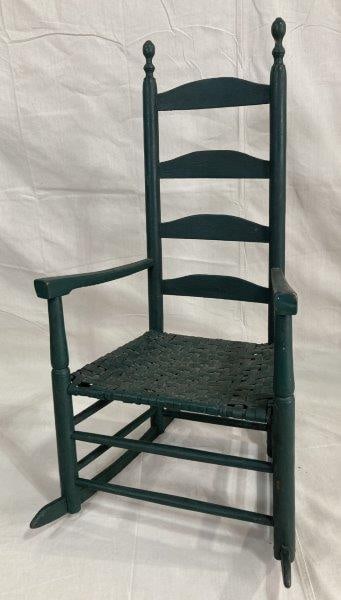 Country Painted Rocking Chair: Charming country rocking chair with shaped splats, turned posts, and a woven seat. Retains a pleasing old green painted surface with attractive wear. Solid and well-proportioned. Measures approx. 41''