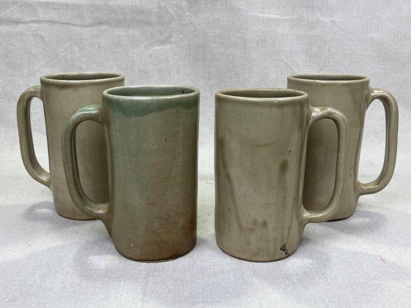 Set of Four D.X. Gordy Art Pottery Mugs: Handmade set of four matching mugs by D.X. Gordy, featuring a light green and tan glaze with subtle earthy tones. Each is stamped "Hand Made by D.X. Gordy" on the base. Each mug measures approx. 5 1/2