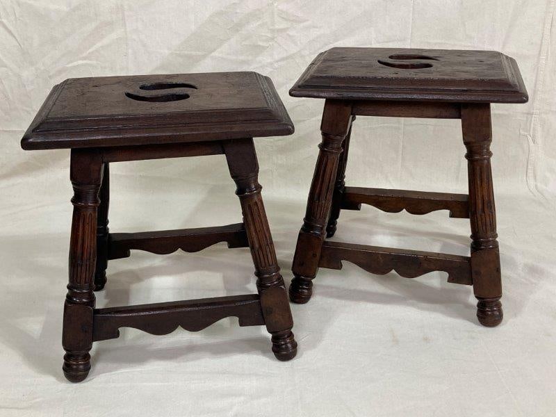 Pair of Italian Baroque Stools: Each with a pierced seat, shaped apron, and reeded legs terminating in turned bun feet. Constructed with pinned joinery in the traditional manner. Each measures approximately 18"H x 15 1/2"W x 11 1/2"