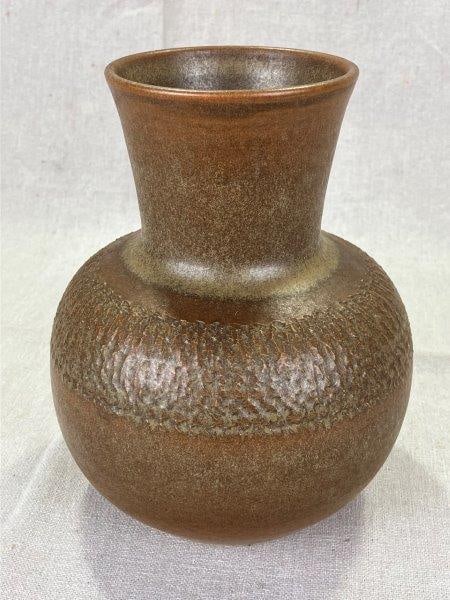 W.J. "Bill" Gordy Decorated Vase with Mountain Gold Glaze: Striking hand-thrown vase by W.J. Gordy featuring his signature Mountain Gold glaze and a wide band of incised decorative motifs encircling the body. Stamped "Hand Made by W.J. Gordy" on the base. Mea