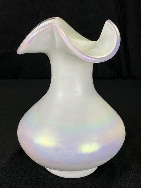 Fenton Pearlescent White Glass Vase: Features an elegant rounded form with a delicately ruffled rim accented by soft pink edging. Measures approximately 7 1/4''T x 6'' in diameter. Good condition.