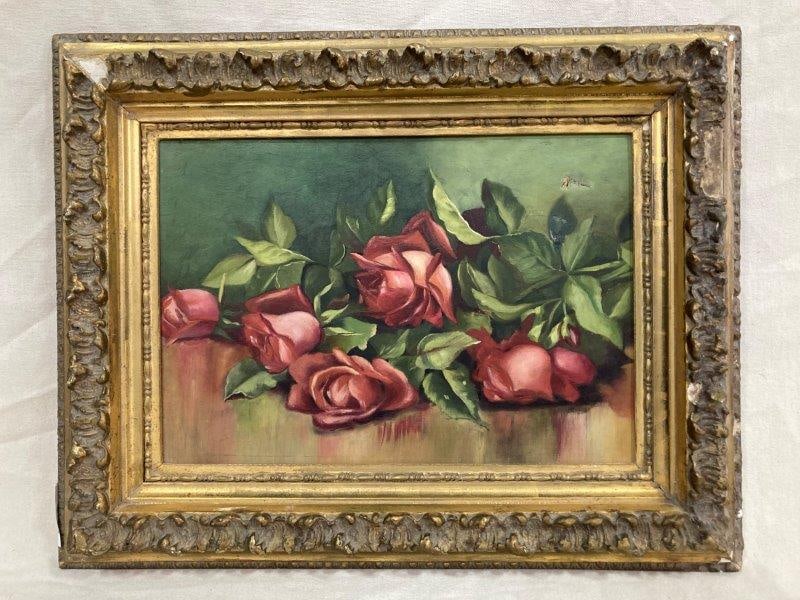 19th Century Still Life of Roses: Charming 19th-century still life depicting cut red roses laid across a tabletop, rendered in deep red and green tones. Housed in a carved gilt frame. Measures approximately 15" x 19". Some loss to the