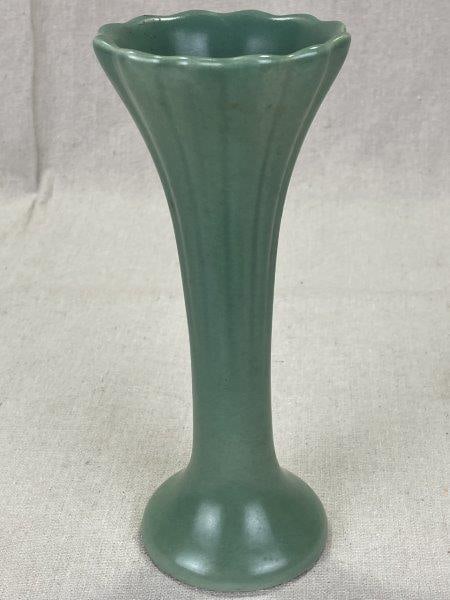 Art Deco Trenton Pottery Vase: With its vertically fluted sides and soft light green glaze, this vase embodies the streamlined elegance of the Art Deco era. Marked "Trenton Pottery" on the base. Measures approximately 8"H x 3"W. Go