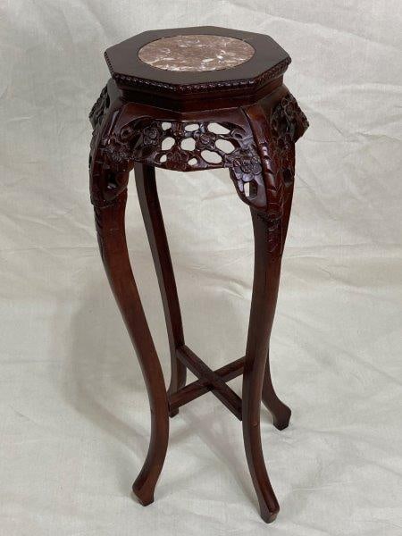 Carved Chinese Plant Stand: Vintage dark wood with a marble center, Measures approx. 36 1/2''T x 13'' in diameter. Some wear to finish.