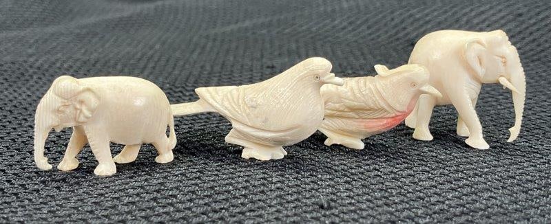 Carved Bone Assortment of Miniature Sculptural Birds and Elephants: An assortment of finely carved ivory miniatures, including birds and elephants, showcasing detailed craftsmanship and delicate execution throughout. One elephant measures approximately 1 1/4" tall x 1