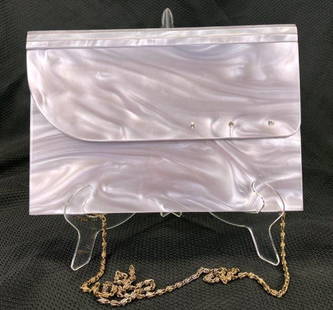 Vintage Opalescent Lucite Evening Bag with Rhinestone Detail: Elegant vintage Lucite evening bag featuring a soft lavender opalescent glow and a front panel adorned with cut rhinestones. The structured form is complemented by a gold tone strap, adding a refined