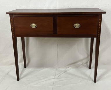 Federal Style Inlaid Huntboard: A fine 20th-century Federal style huntboard crafted in mahogany, featuring tapered legs, bellflower inlaid detailing, and original brass eagle motif pulls. Measures approximately 39 7/8" H x 48" W x