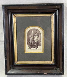 Early Photograph of Hunters with Dog in Carved Gilt and Walnut Frame: Striking early photograph depicting four hunters posed with shotguns and a loyal dog at their feet, capturing a vivid moment of sporting life. Housed in a beautifully carved gilt and walnut frame.