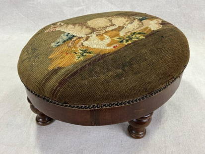 Needlepoint Footstool with Wolf and Goose Motif: Charming footstool featuring a hand-stitched needlepoint top depicting a dramatic scene of a wolf and goose, set against an aged wood frame with rich patina. Measures approximately 6'' H x 11'' W x