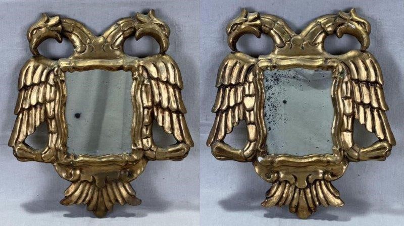 Pair of Antique Gilt Glass Mirrors with Double-Headed Eagle: A striking pair of antique mirrors featuring the double-headed eagle an imperial emblem associated with the Holy Roman Empire and symbolic of courage, power, and immortality. Crafted with gilded frame
