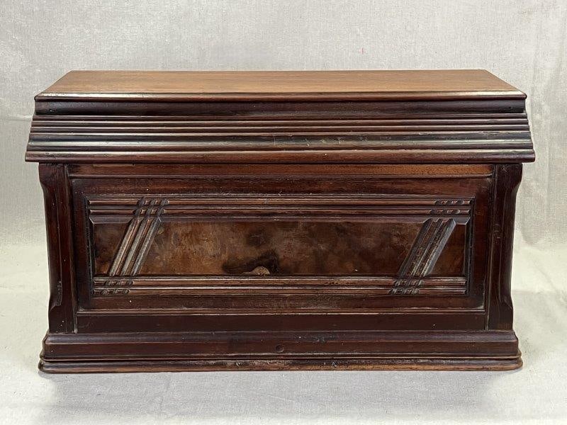 Decortive Walnut Box: A charming walnut box featuring a decorative burled wood front panel and interior storage compartments. Measures approximately 10 7/8" T x 18 7/8" W x 10 1/2" D. In good condition with light edge wear