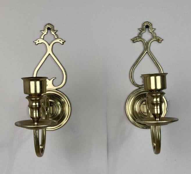 Pair of Virginia Metalcrafters Wall Sconces: Decorative cast sconces in the form of stylized goose heads, finely detailed and marked by Virginia Metalcrafters. A striking blend of function and form. Measures approx. 10 1/2'' H x 4'' W x 11'' D. 
