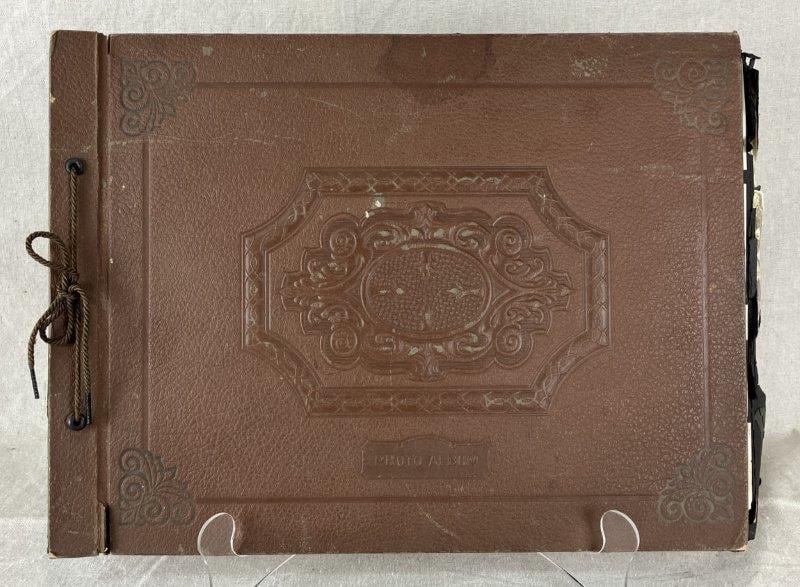 1930s Photo Album: Extensive family photo album from the 1930s featuring over 100 black-and-white photographs. Subjects include family gatherings, domestic and wild animals, work scenes, travel snapshots, and vintage au