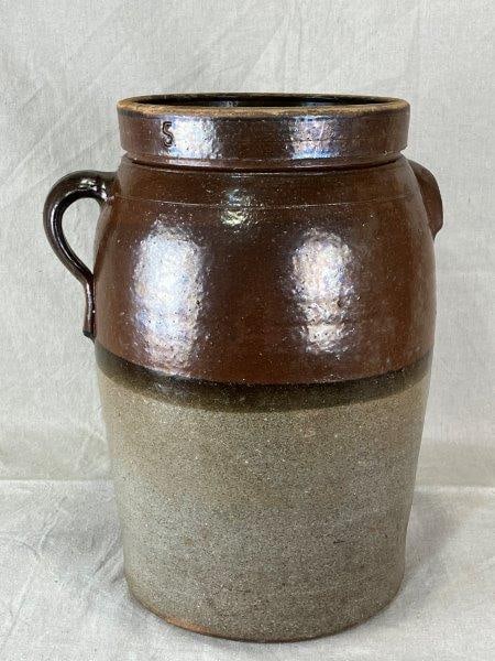 Attributed to Stevens Pottery Stoneware Churn: 19th century Georgia example with three-band glaze in salt and Albany slip, attributed to the renowned Stevens Pottery. Features lug handles with incised ring decoration. Measures approximately 16 1/8