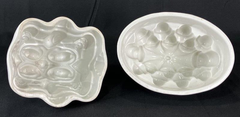 Pair of Ironstone Molds: Fine examples of 19th-century ironstone kitchenware, each showcasing geometric design elements of the period. One mold measures approximately 6" H x 7 1/2" W x 5 3/8" D. Minor discoloration present, w
