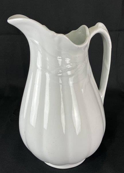 Wedgwood Ironstone Pitcher: Elegant 19th-century Wedgwood ironstone pitcher featuring an ornate leaf and wheat design in relief and a robust, well-balanced form. Measures approximately 12 1/2" H x 8" W x 6" D. Good condition wit