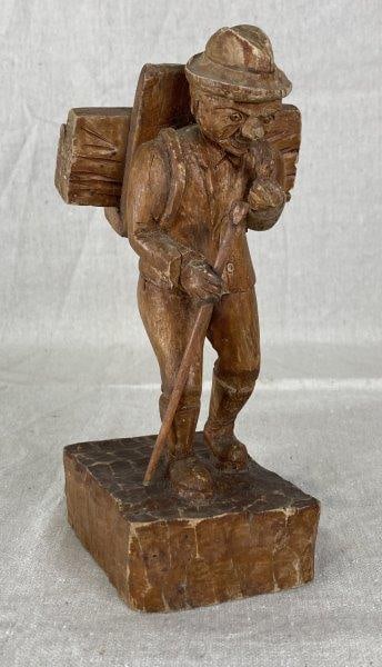 Folk Art Hand Carved Hiker: Beautifully carved wooden hiker figure with finely detailed features and expressive character. Measures approximately 7 1/2'' H x 2 3/4'' W x 3 1/2'' D. Good condition with light wear consistent with 