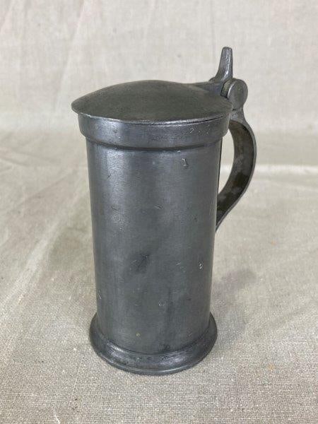 Small Pewter Tankard: Hinged lid with side mark, finely proportioned form. Measures approximately 5 1/4" H x 3 1/4" W x 2 1/2" D. Good condition.