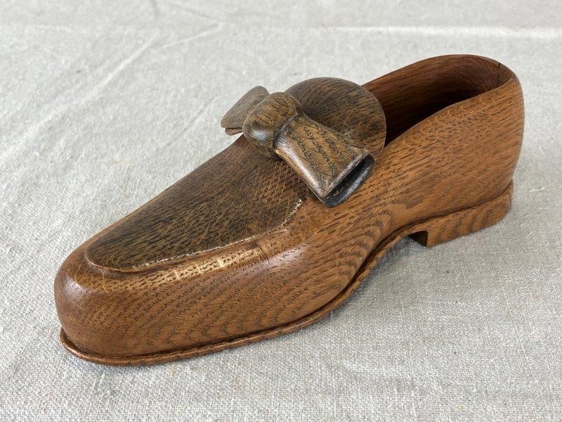 Finely Carved Wood Shoe: Detailed oak carving signed by the maker on the heel. Measures approximately 2 3/8" H x 7" W x 2 3/8" D. Good condition.