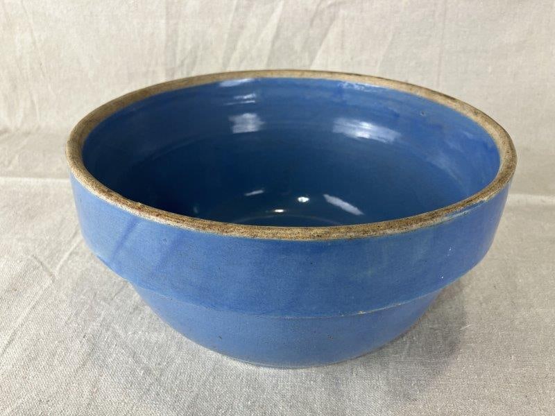 Blue Stoneware Mixing Bowl: A classic blue stoneware mixing bowl with a rim. Measures approximately 5¼" H x 10" D. Good condition.