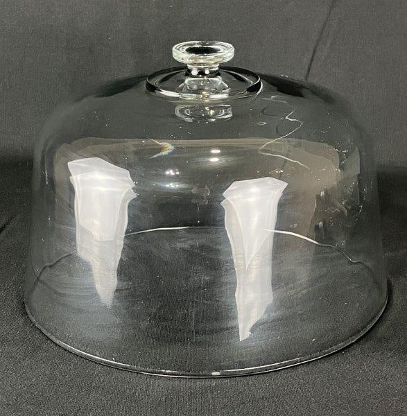 Glass Cake Dome: Vintage glass cake dome of generous size, featuring a clear, rounded form ideal for displaying baked goods. Measures approximately 8" H x 11" in diameter. Good condition.