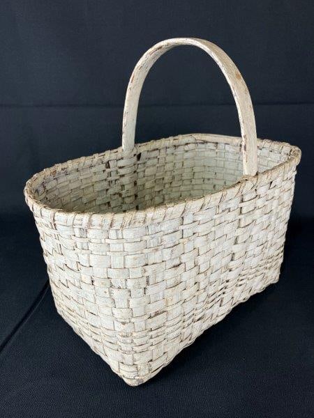 White Gathering Basket: Finely woven and painted in an aged white finish, Measures approximately 13" H x 13 1/8" W x 8" D. Good condition with appropriate wear to the old paint, minor damage to one corner, and some loss to t