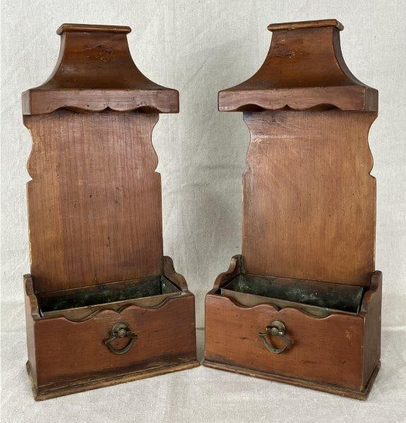 Pair of Alfred Assid Flower Holders: Shaped adornments with original copper liners, maker’s name is branded on the back. One measures approximately 15 1/8" H x 6 3/4" W x 4" D. Good condition with age-appropriate wear and oxidation