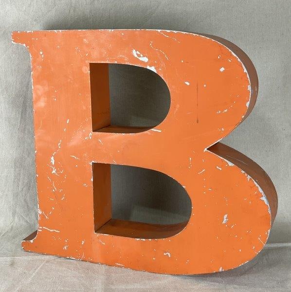 Painted Orange Tole Letter: Vintage, orange-painted letter “B,” measuring approximately 17 5/8" H x 18" W x 3 1/8" D. Good condition with some paint loss.