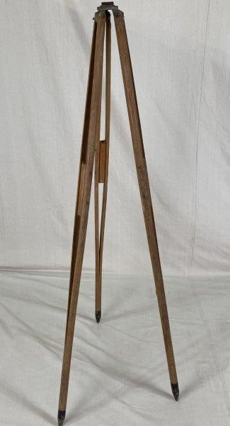 Tripod Base: Tall tripod base with worn surface, displaying a rustic aged character. Measures approximately 60" H. Good condition with surface wear.