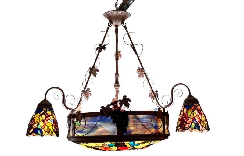 Stained Glass Chandelier: Beautiful marbled stained glass Tiffany-style chandelier with scrolling vine decoration and fruit motifs. Measures approximately 29'' x 34''. Good condition.