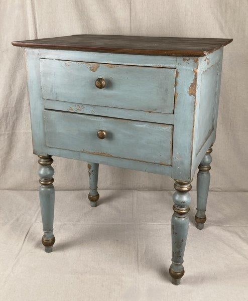 Painted Two-Drawer Stand: Charming two-drawer stand featuring a wood top with a rich dark patina above a blue-painted body accented with gold highlights. Supported on turned legs in a traditional form. Measures approximately 3