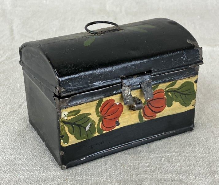 Toleware Small Box: Delicately hand-painted with a floral band and leaf motif near the upper handle. Measures approximately 3" H x 4 1/8" W x 2 3/4" D. Retains original character with age-appropriate wear, including pain