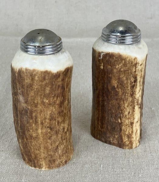 Antler Creations Elk Antler Salt and Pepper Shakers: A 2001 creation from Antler Creations, crafted from natural elk antler sections. Signed on underside. Each shaker retains the rustic character of the material, with one measuring approximately 4" H x 