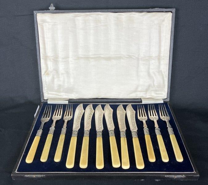 Silverplate Flatware with Bone Handles: Collection of ornately decorated silverplate knives and forks featuring distinctive bone handles and curving interlocking line patterns throughout silverplate. Presented in the original fabric-lined p