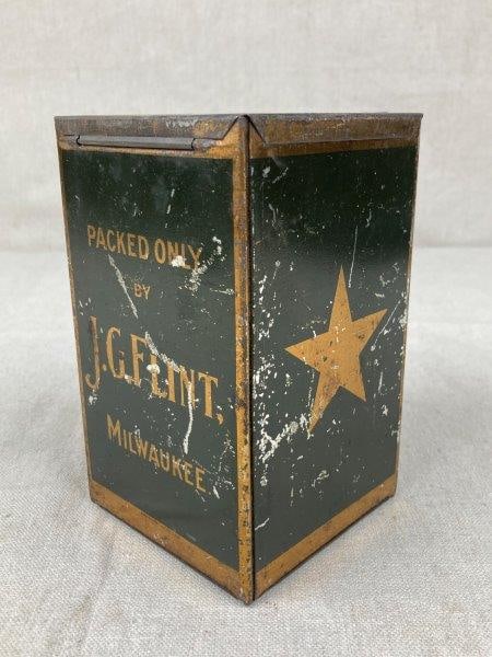 Coffee Advertisement Tin: Gold and black polychrome coffee advertisement tin made by J.G. Flint. Features gold star motifs, with the sides inscribed “Packed Only by J.G. Flint Milwaukee” and “Coffee.” H