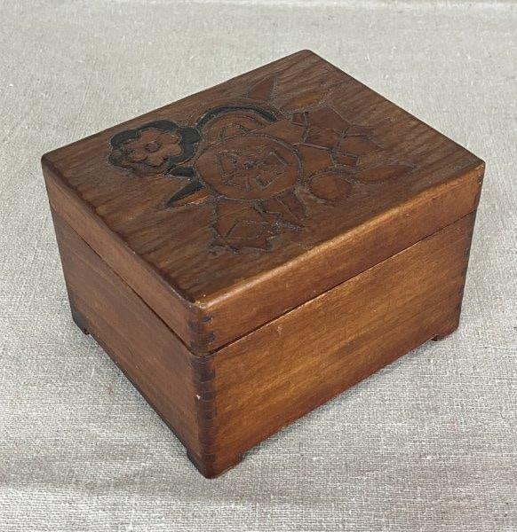 Hand-Carved Folk Art Wooden Box: Charming folk art box featuring hand-incised floral motifs, carved by an independent artisan. Nicely proportioned form, measuring approximately 3" H x 3 5/8" W x 4 1/2" D. Good condition with minimal 