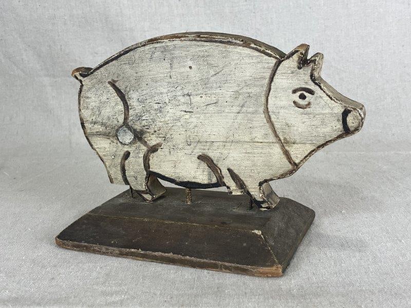 Folk Art Painted Wood Pig: Charming folk art pig in a light buff-toned painted finish with animated brushed features throughout. Measures approximately 5 3/8" H x 8" W x 4" D. Age-appropriate wear with abrasions and paint loss,