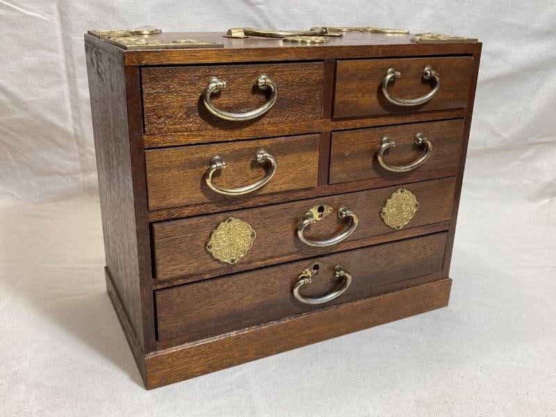 Vintage Japanese Jewelry Box: An elegant mahogany jewelry box by Andrea by Sadek, featuring brass ormolu mounts with Japanese-inspired motifs and matching drawer pulls. The interior is fitted with velvet-lined drawers for storage.